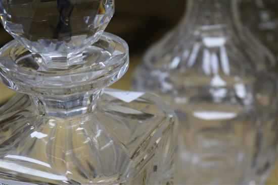 A pair of Victorian cut glass decanters and stoppers and another